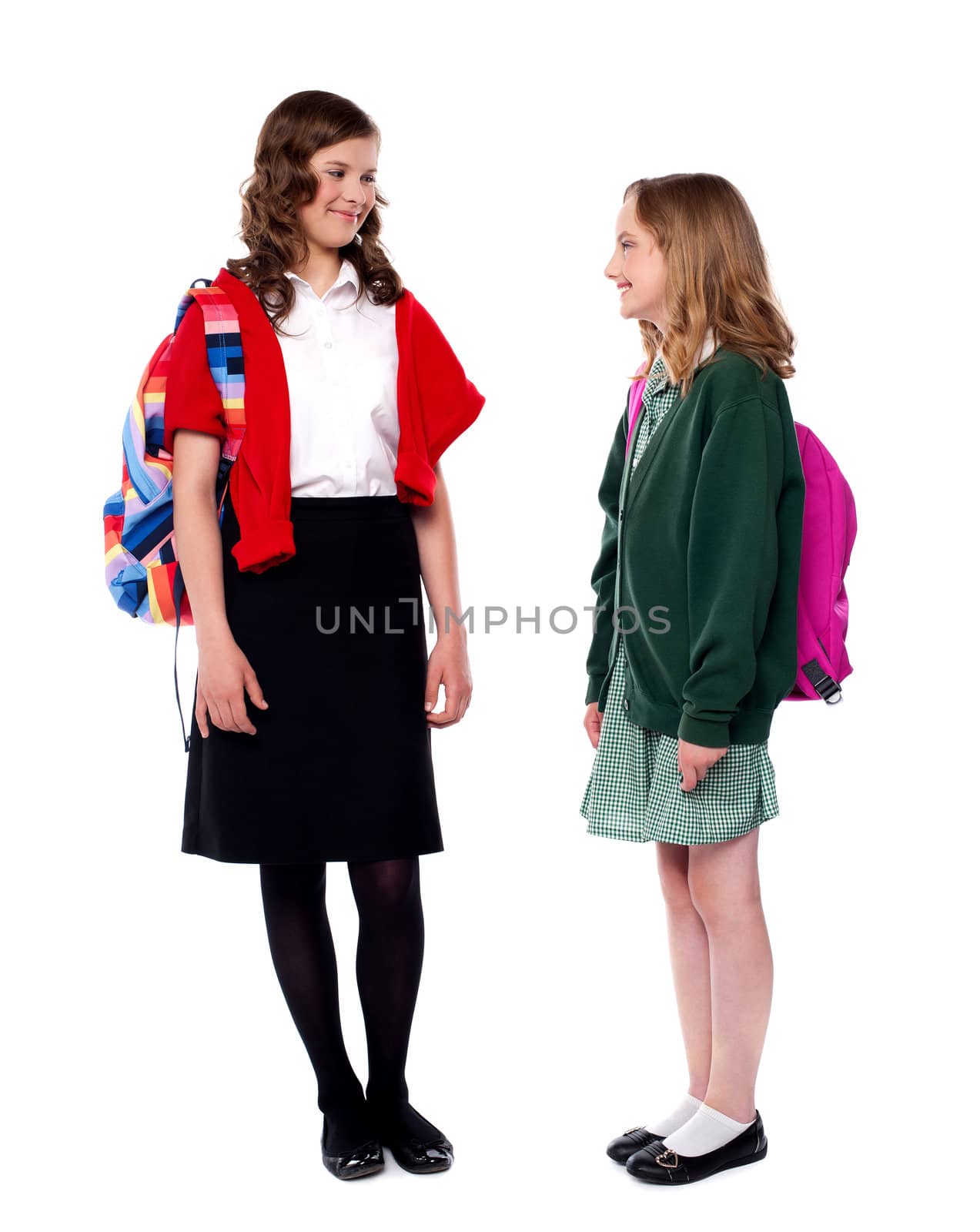 Teenagers discussing their day at school with each other over white background
