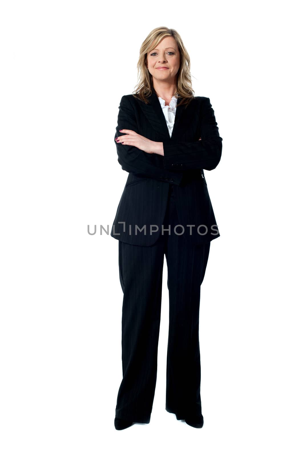 Portrait of glamorous corporate lady posing with arms crossed. Full length shot