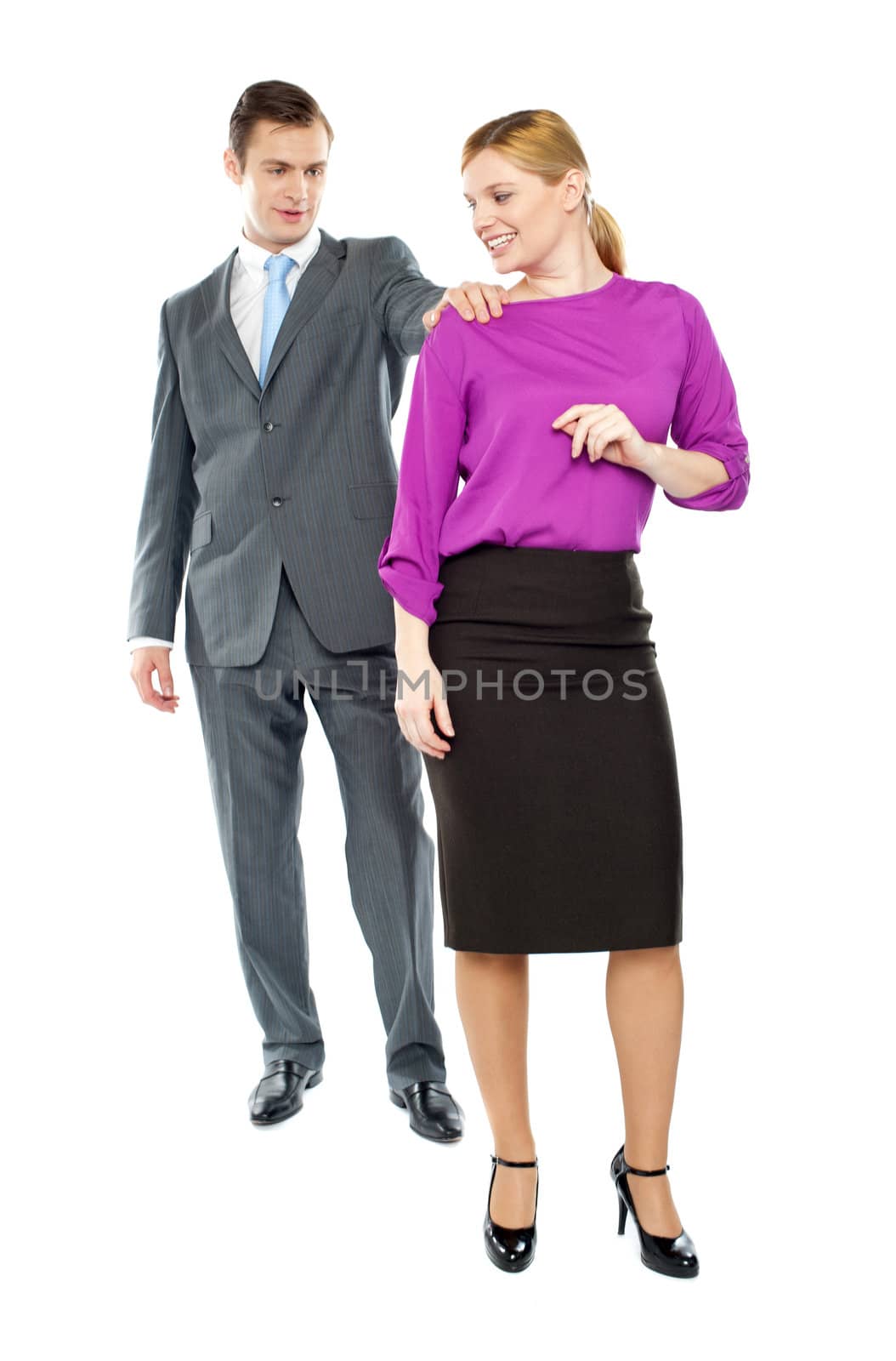 Businessman stopping female secretary to ask her out