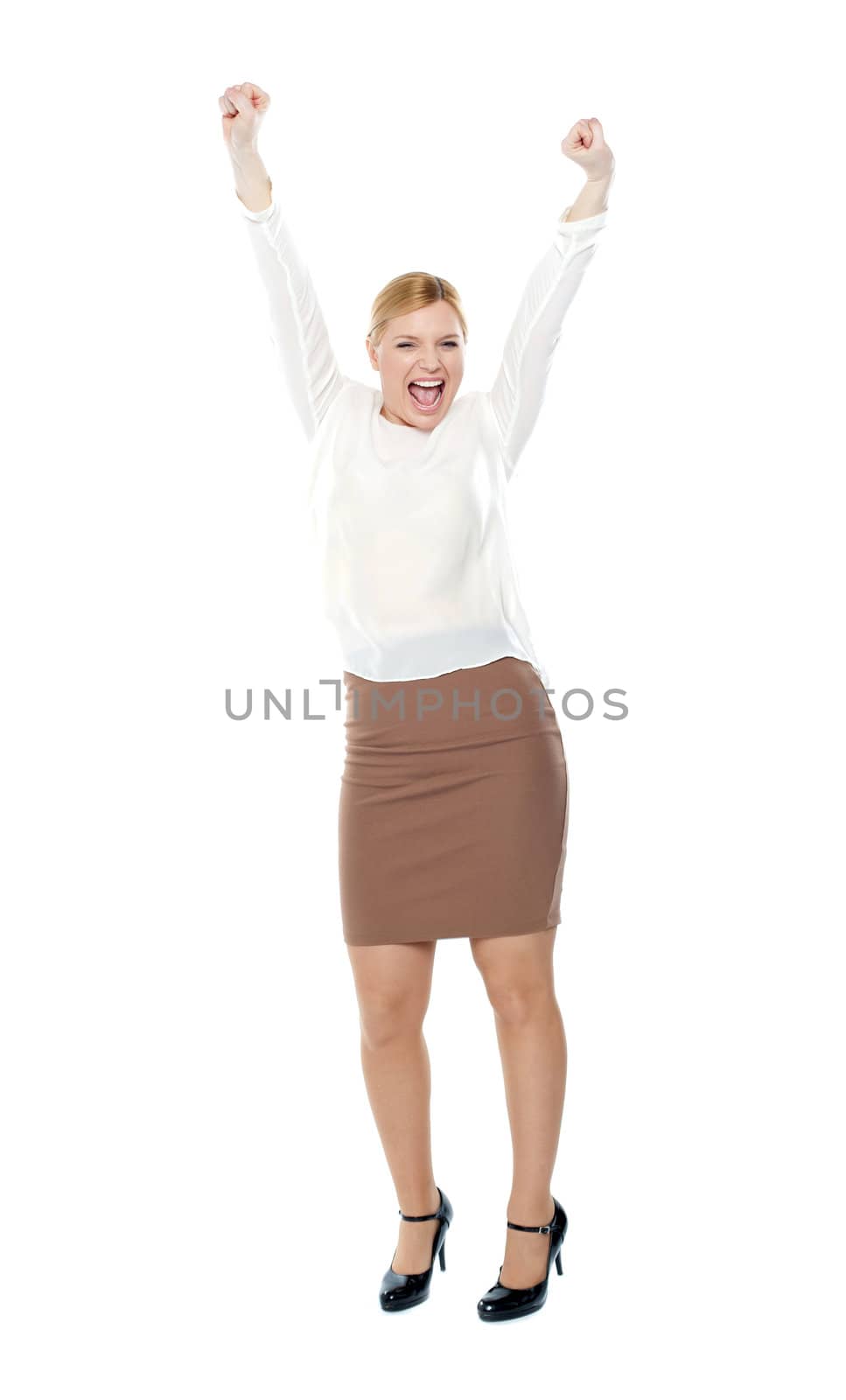 Beautiful blonde female enjoying success with both arms up