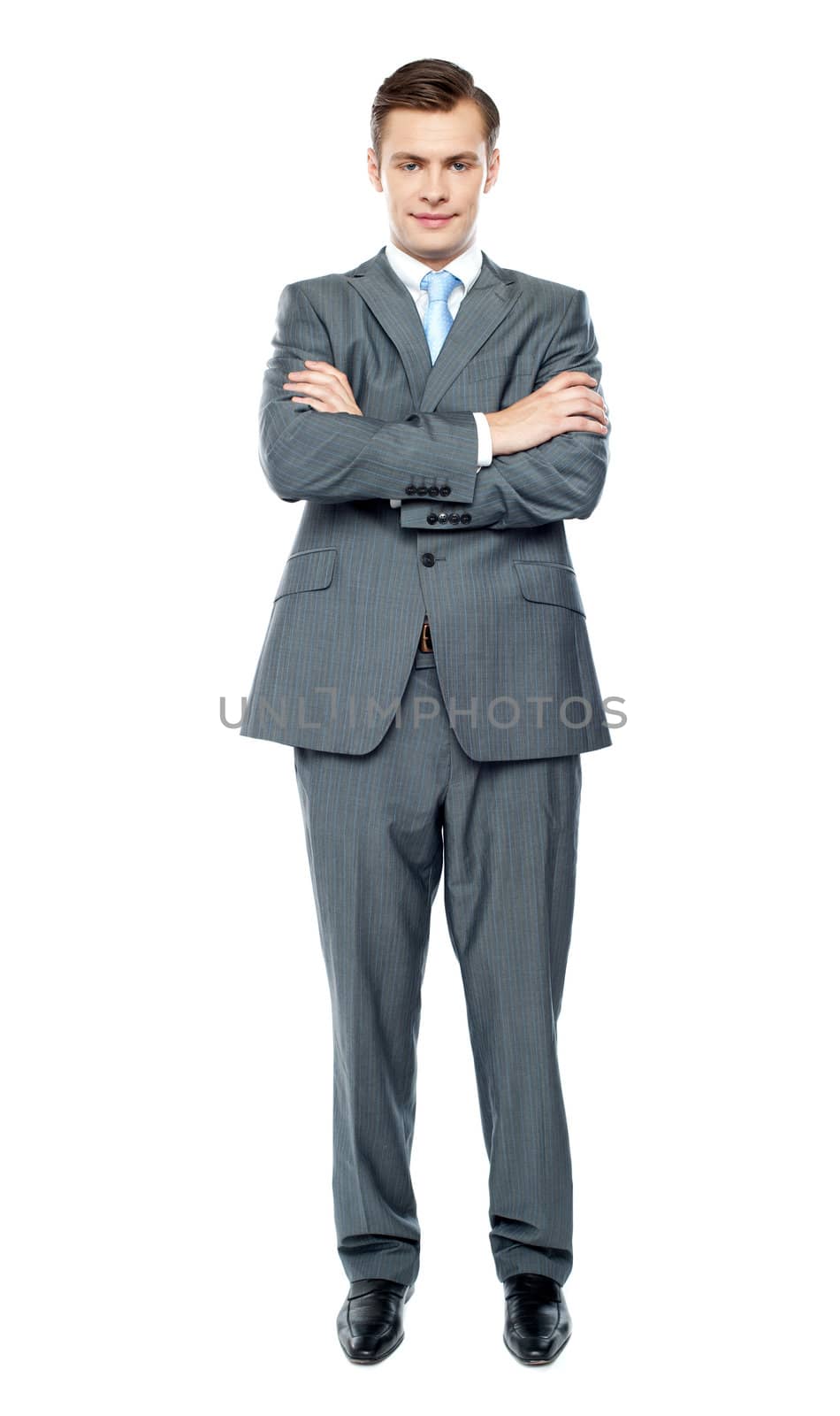 Handsome young executive. Full length portrait over white background
