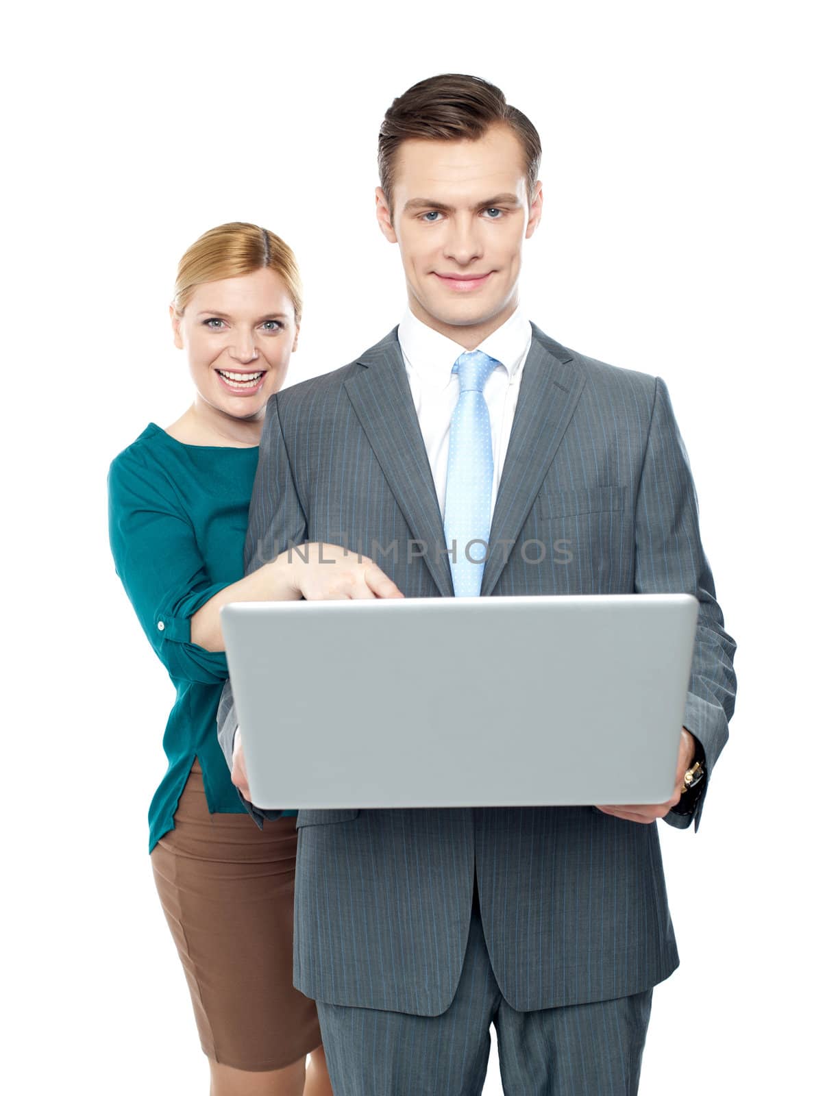 Woman pointing into laptop while guy holding it. All on white background