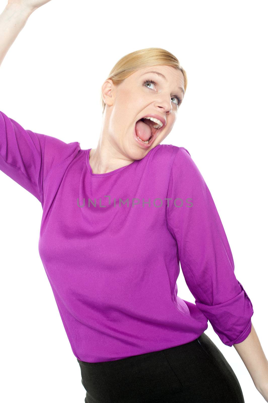 Joyful corporate woman dancing and celebrating her success