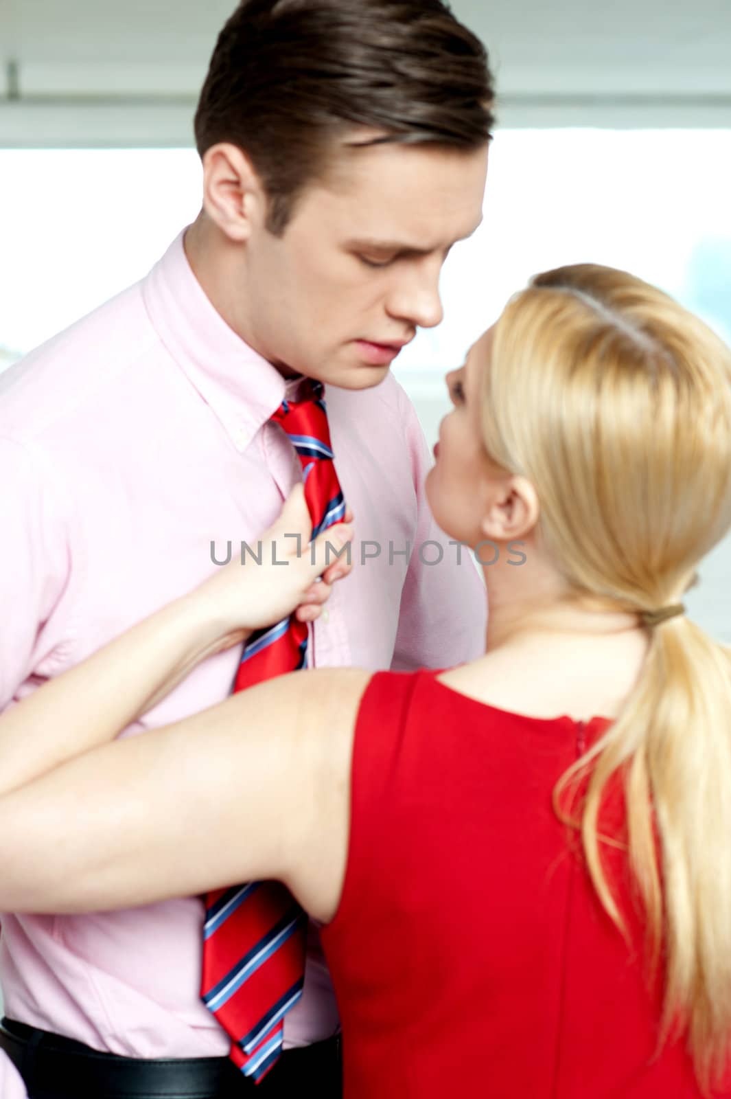 Female secretary forcing boss to love her by stockyimages
