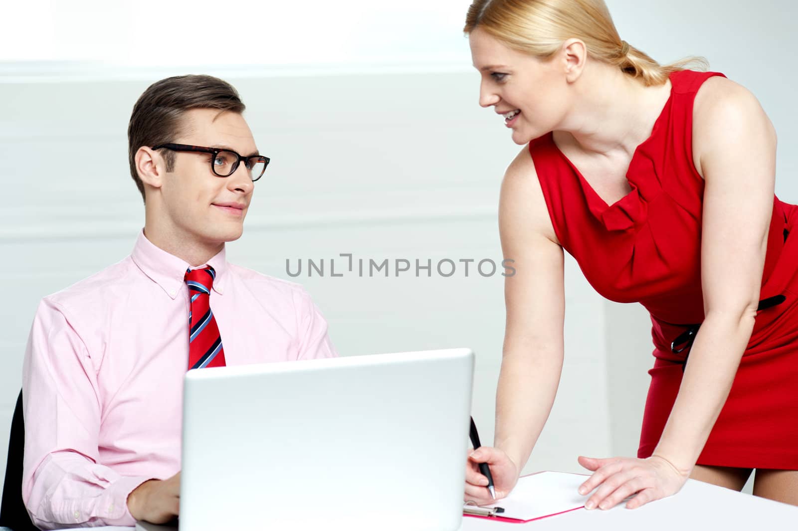 Secretary writing appointments on clipboard by stockyimages