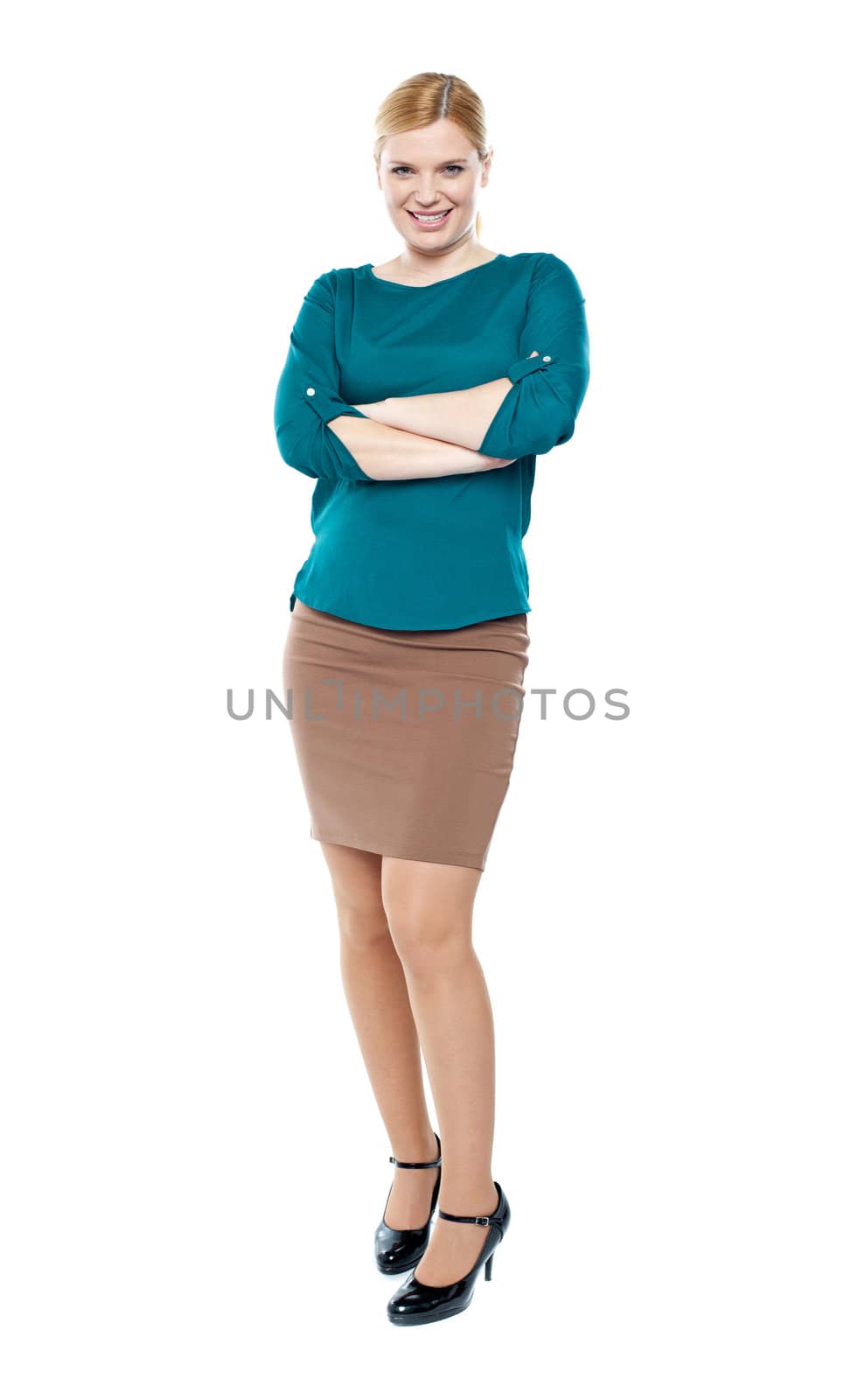 Full length portrait of trendy businesswoman posing with crossed arms