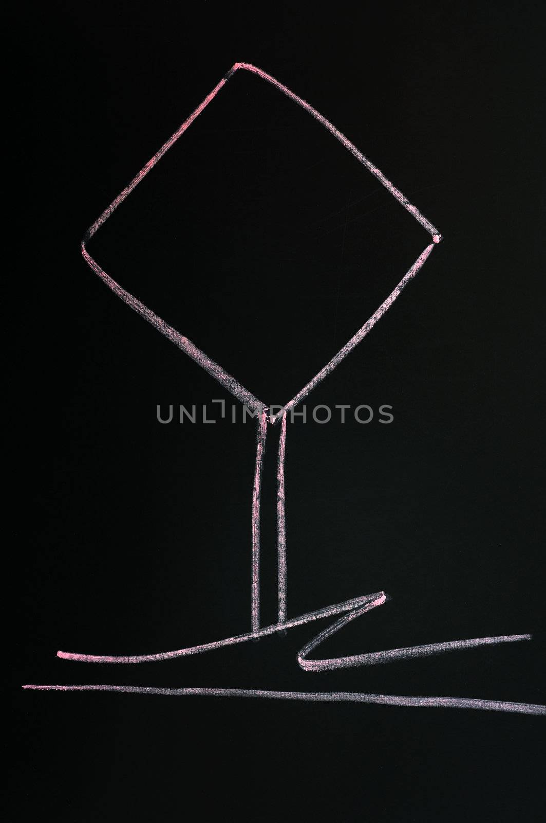Blank warning sign drawn with red chalk on a blackboard background