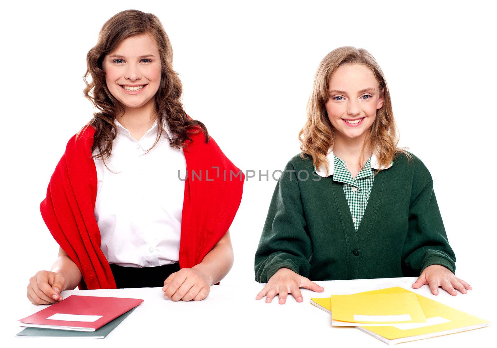 Portrait of teenager students with notebooks. Looking at camera