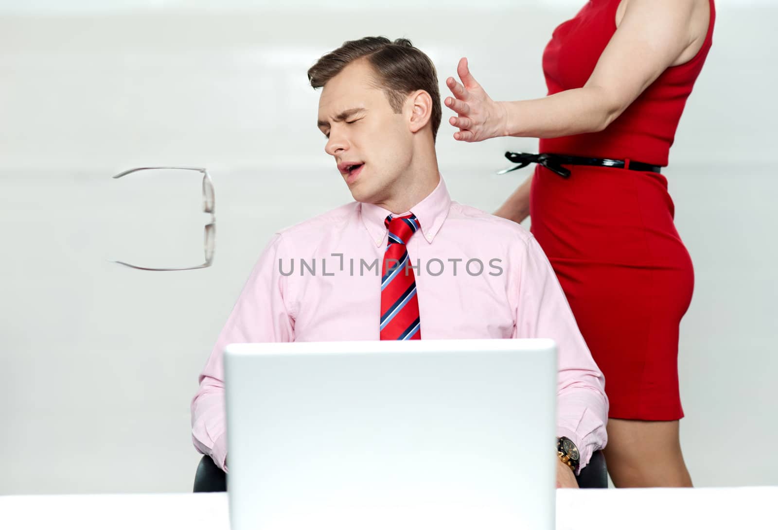 Woman slapping corporate male tightly for misbehaving with her