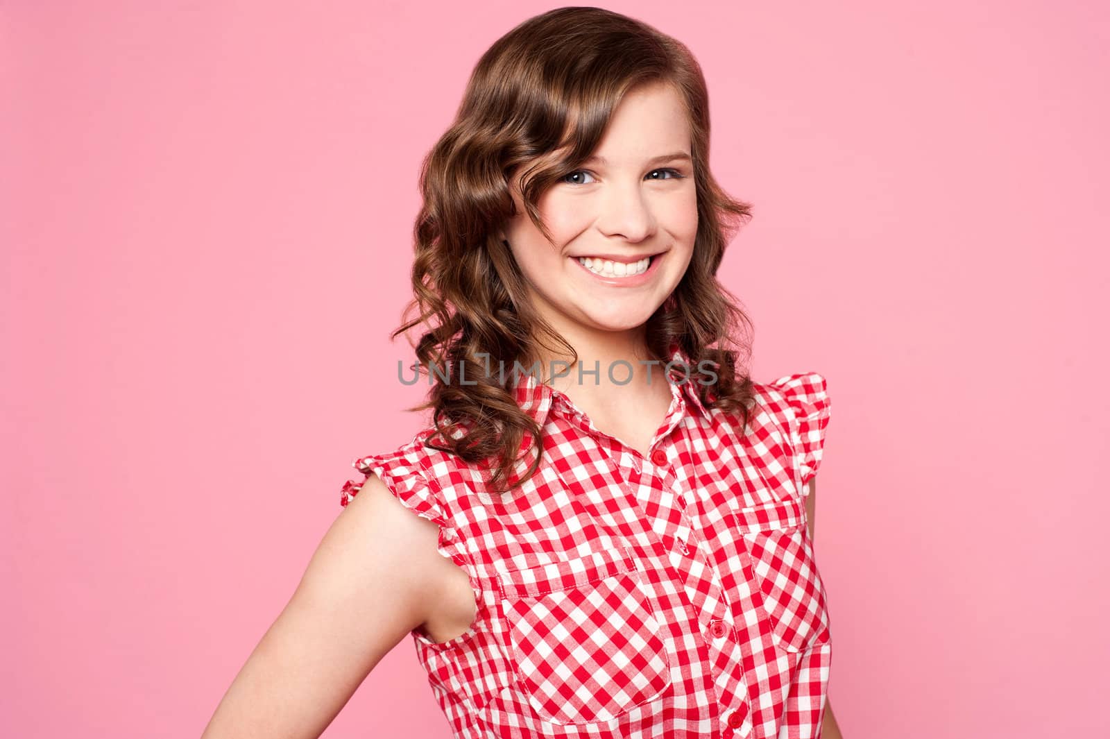 Fashionable smiling caucasian teenager posing with a bright smile