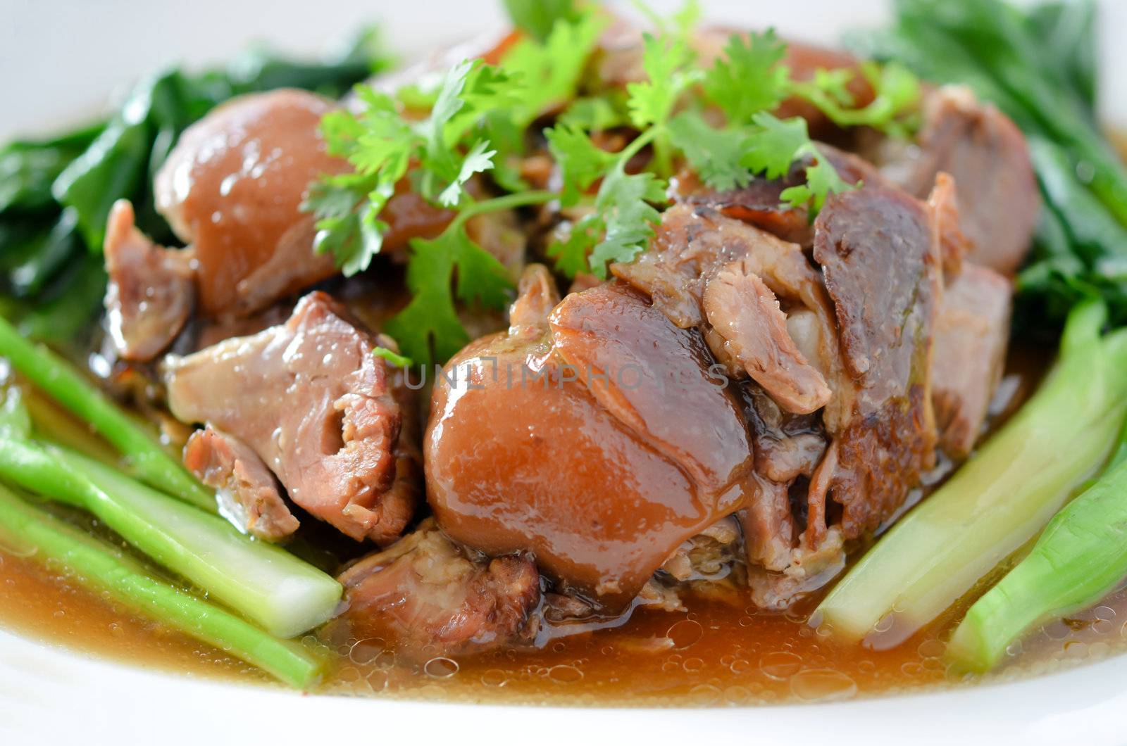 stewed pork knuckle with kale inside , chinese cuisine