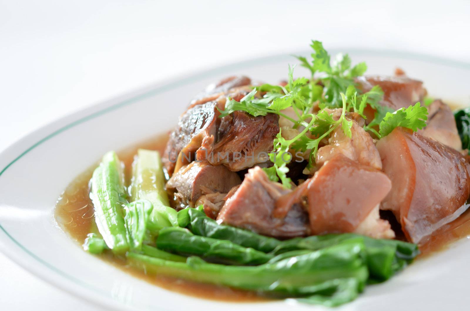  stewed pork knuckle with kale inside on white background