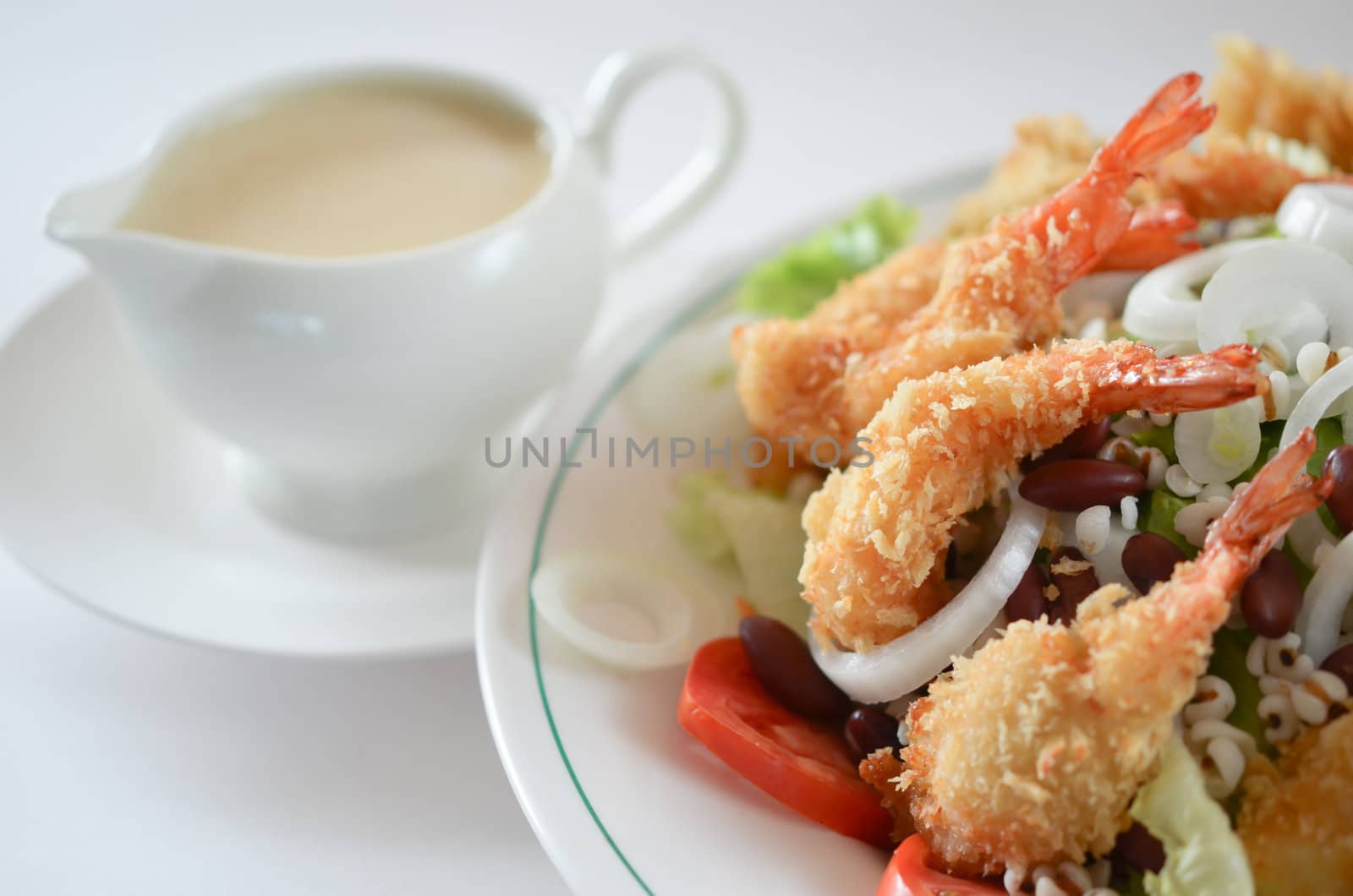fried shrimp and fresh salad with cream sauce
