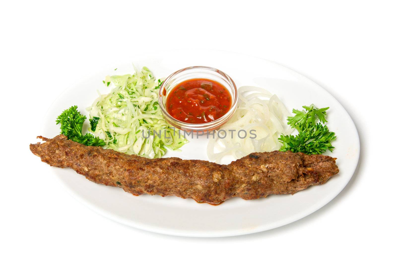 minced mutton chop with sauce and vegetables at dish