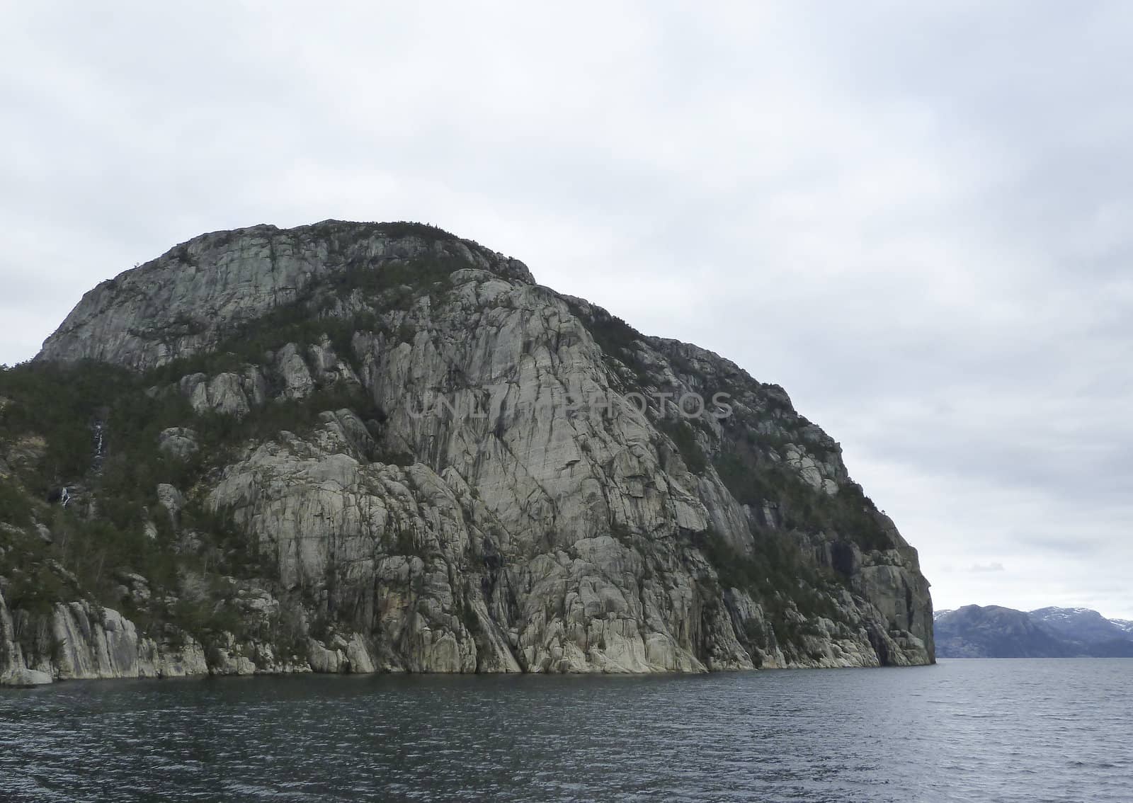 steep rock at coast in norway - horizontal image