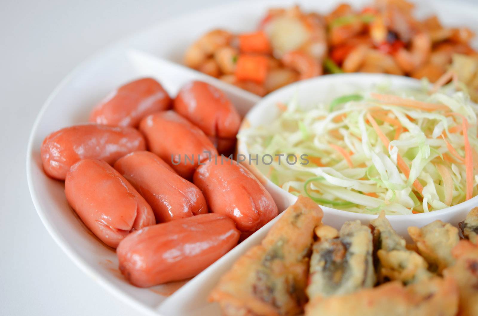 close-up of pork sausage with sweet sauce