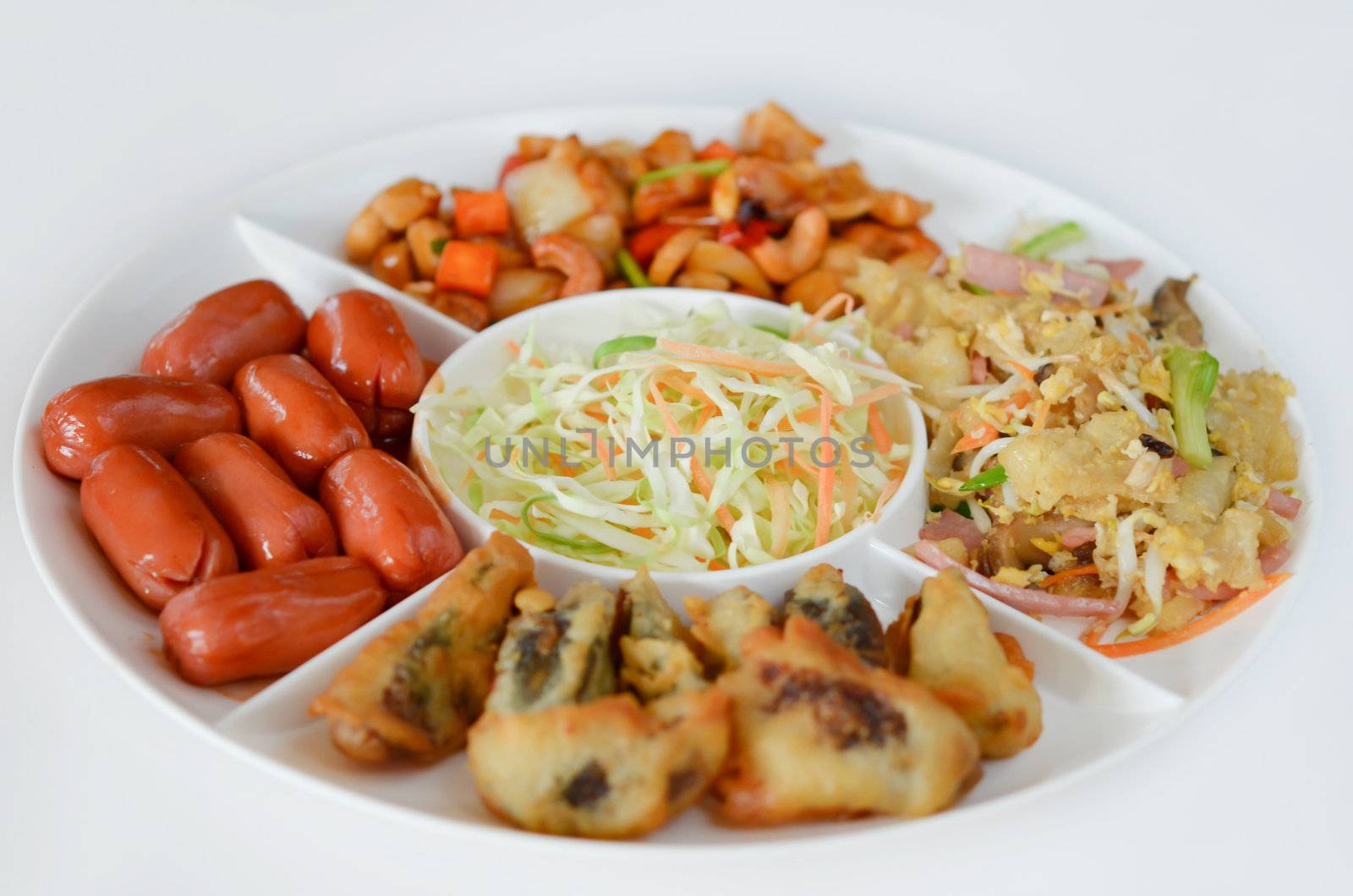  fried pork sausage , fried preserved  eggs, fried fish maw , asian style cuisine