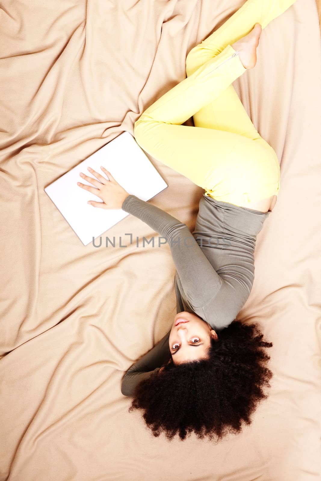 A young adult woman with a Laptop.