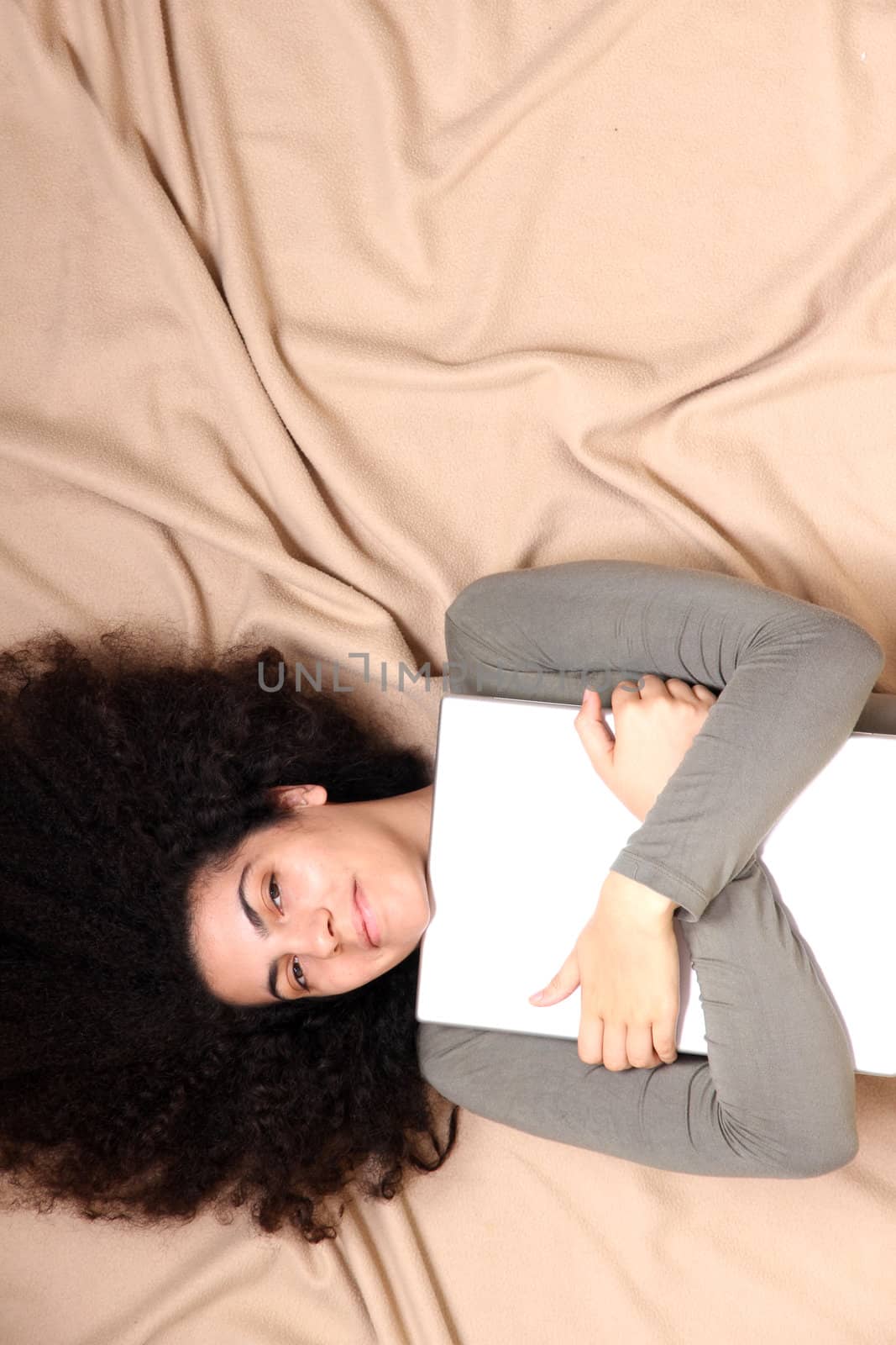 A young adult woman with a Laptop.