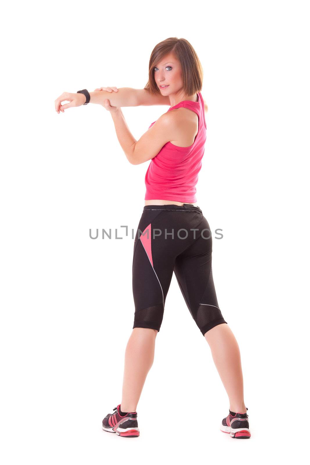 young beautiful sport woman standing making elongation isolated on white background