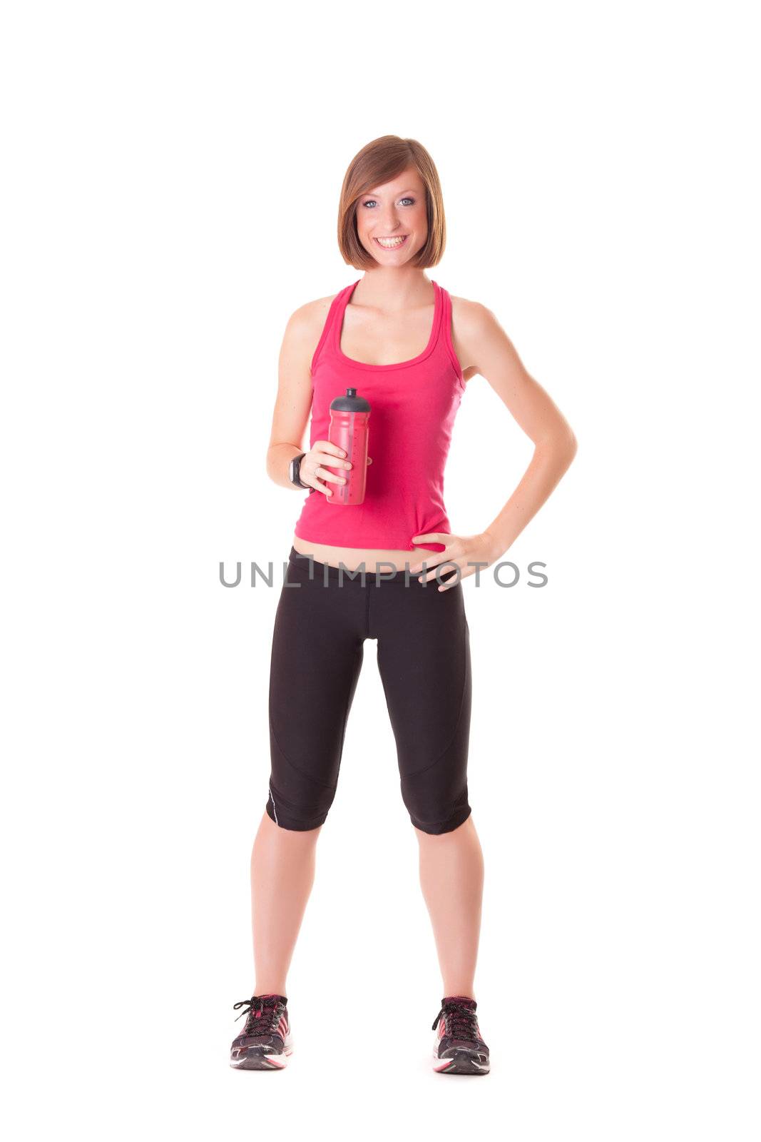 young beautiful sport woman standing with a bottle isolated on w by Lcrespi