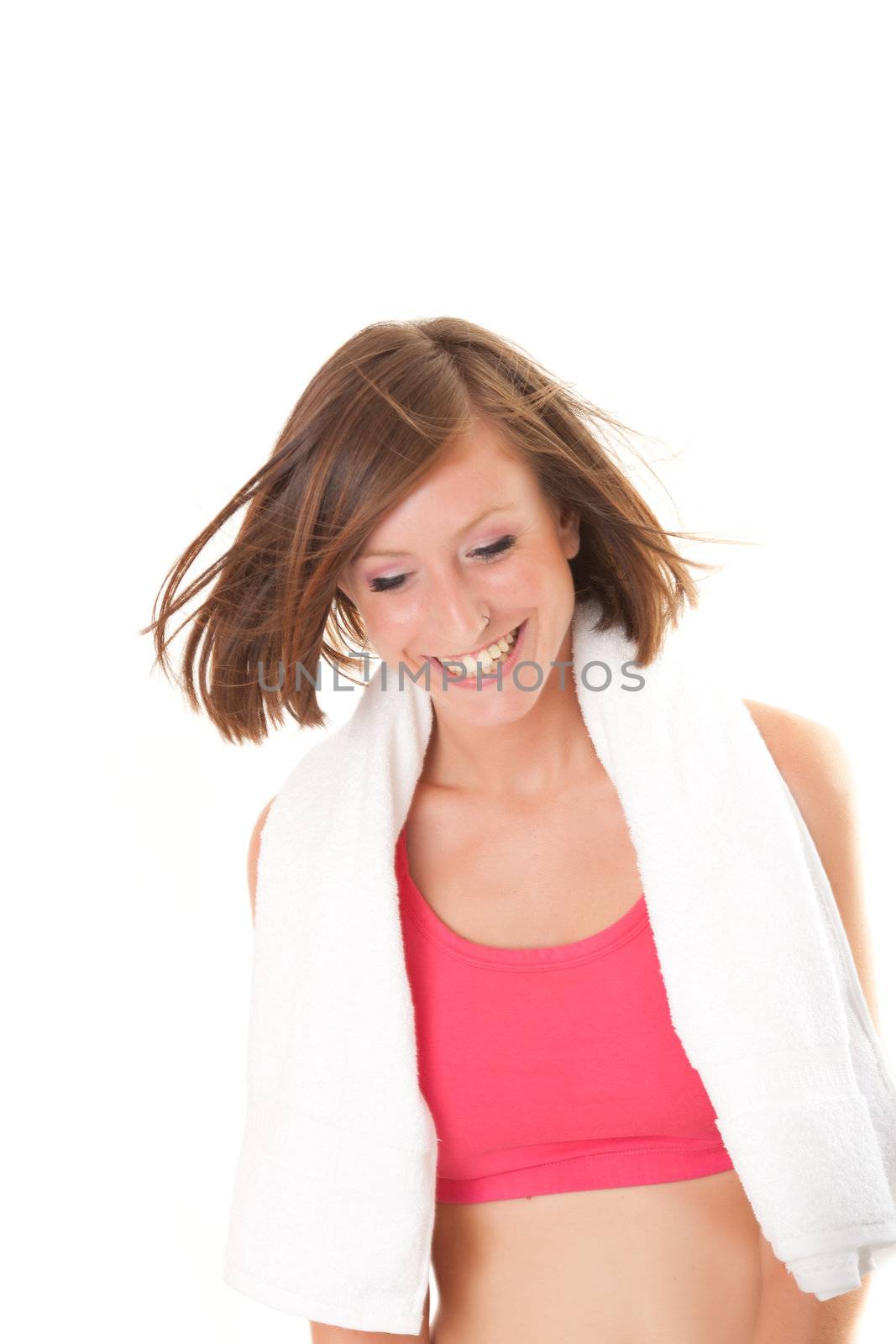 young beautiful sport woman laughing with a towel and a bowl isolated on white background