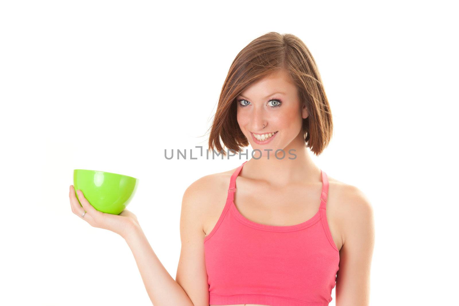 young beautiful sport woman laughing with a bowl isolated on white background