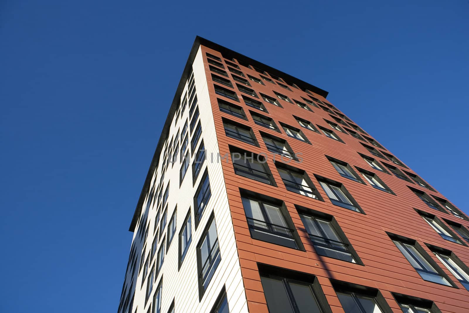 Orange Building Exterior towards Blue sky