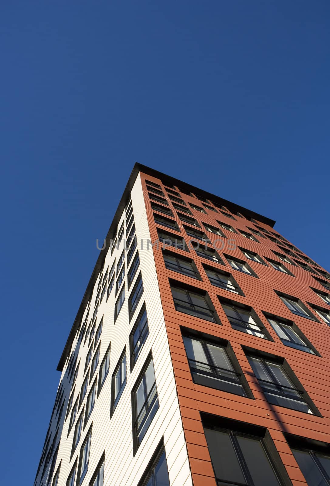 Orange Building Exterior towards Blue sky