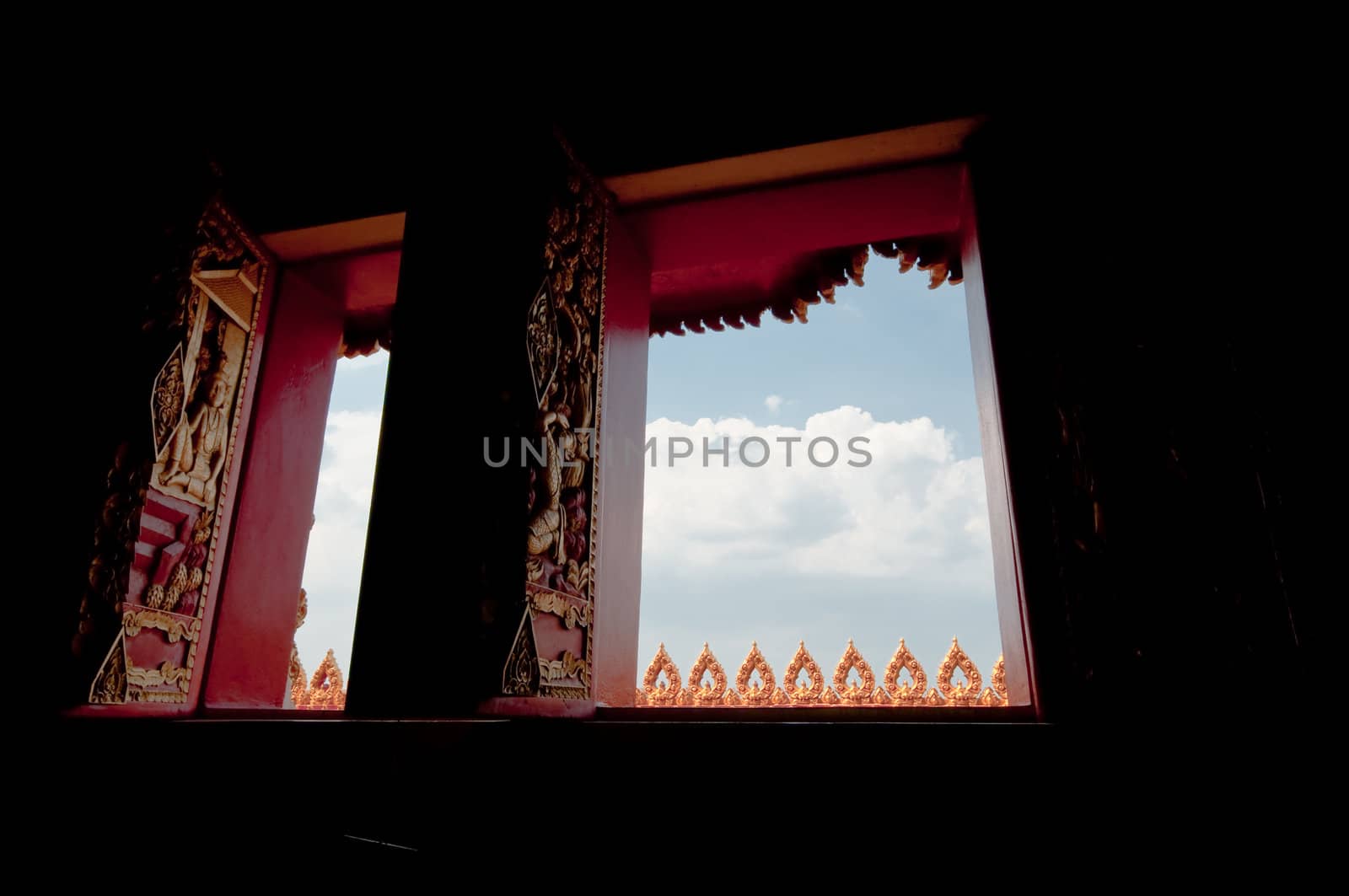 Arts on windows of Phramahathat Khannakhon tower, Khonkaen Province in Northeastern of Thailand