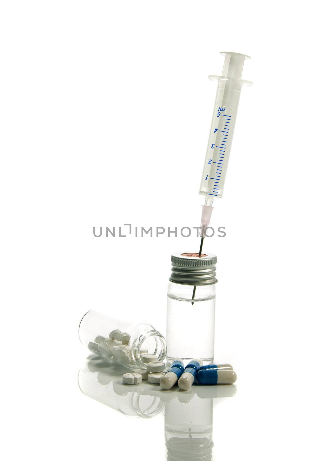 medical needle in bottle with liquid isolated on white