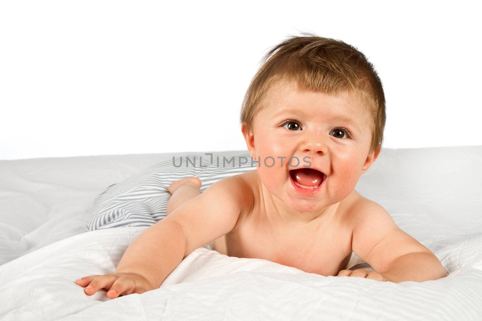 An adorable, laughing baby looking at camera 