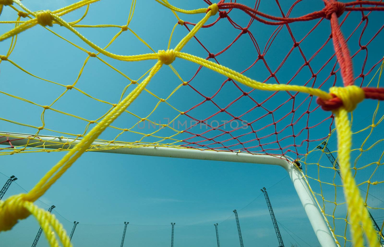 football or soccer goal under the blue sky