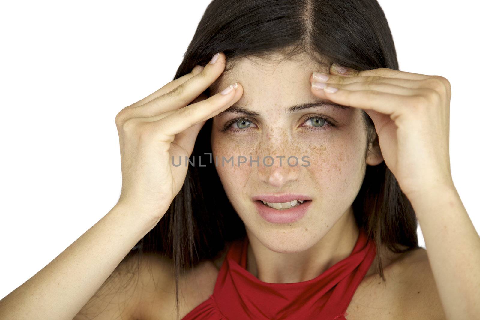 Beautiful female model with freckles and blue eyes suffering headache