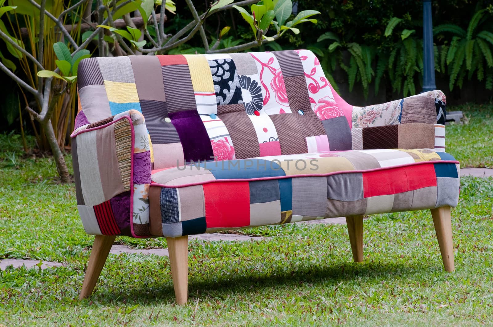 colorful sofa in a green garden