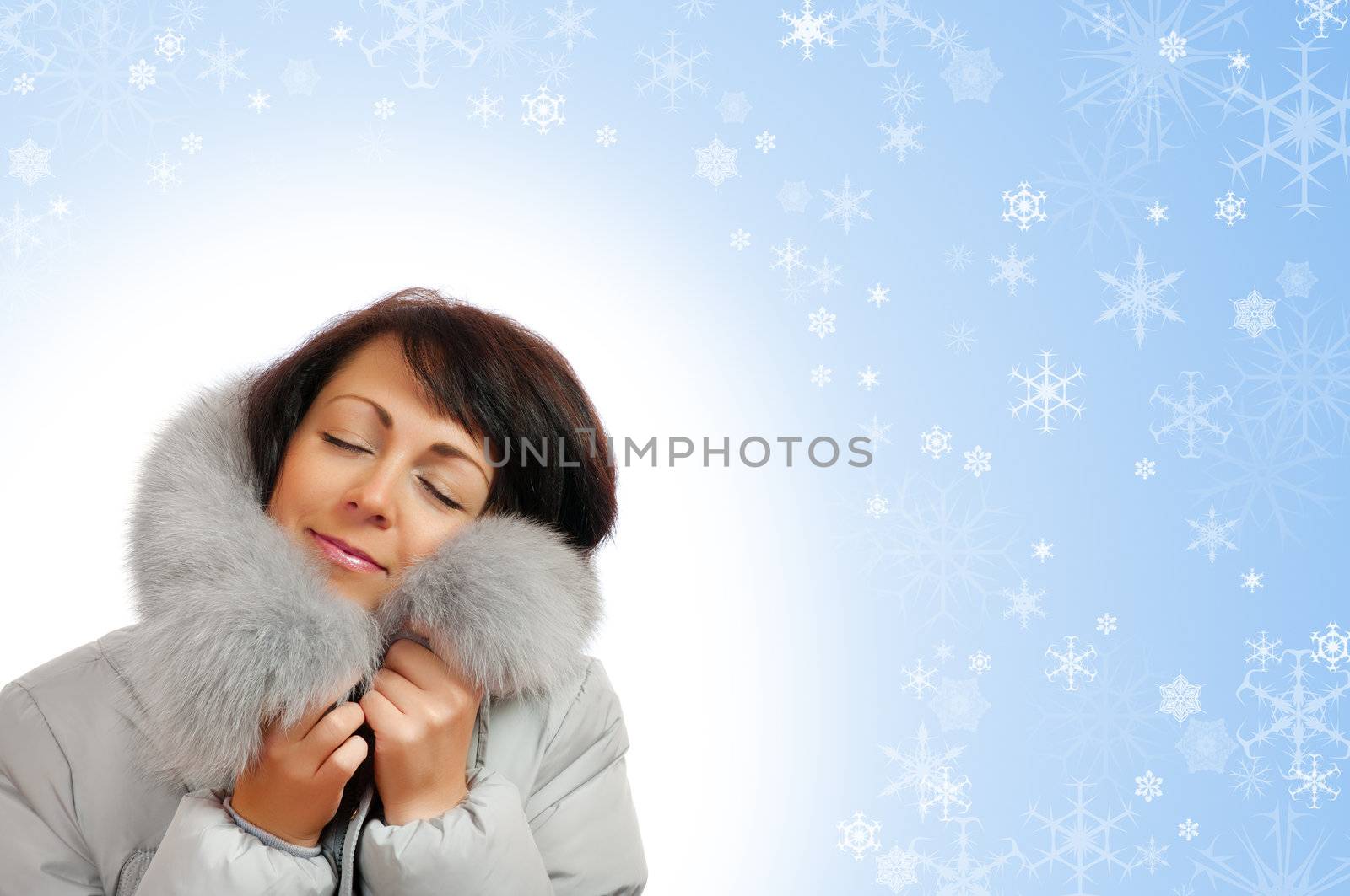 Closeup portrait of young woman in fluffy hood