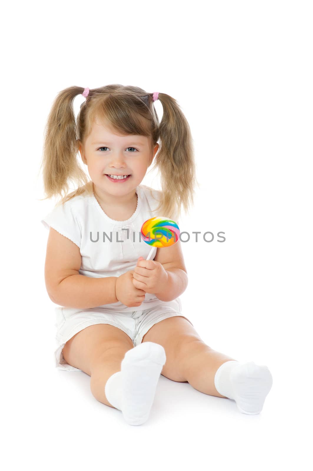 Small smiling girl with lollipop isolated