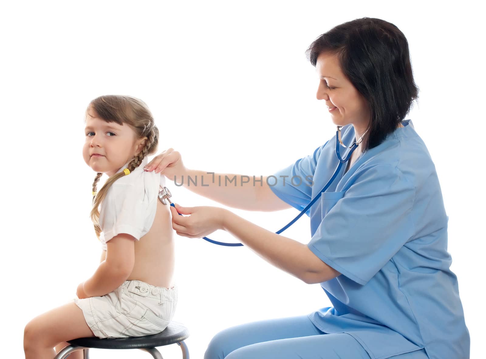 doctor listens by stethoscope little girl