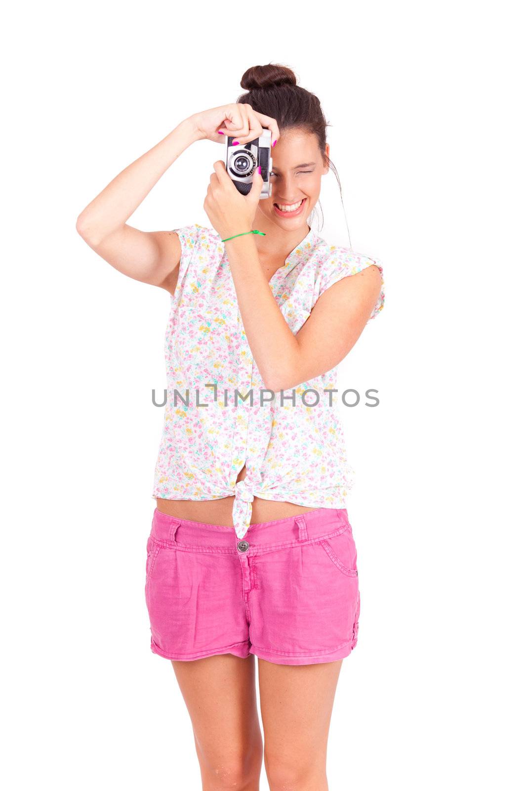 young women taking pictures with vintage camera on white background