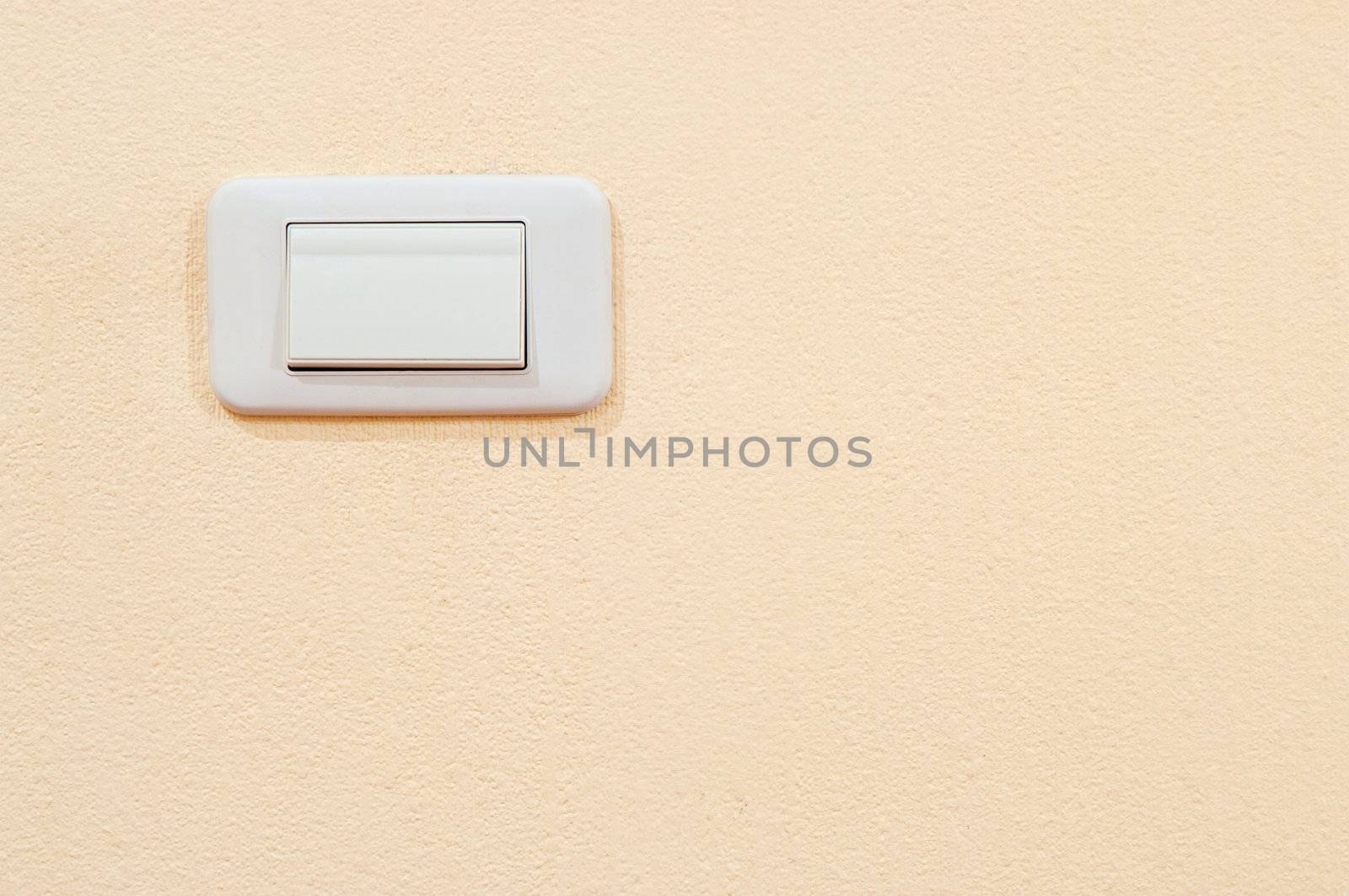 white electric switch on a wall