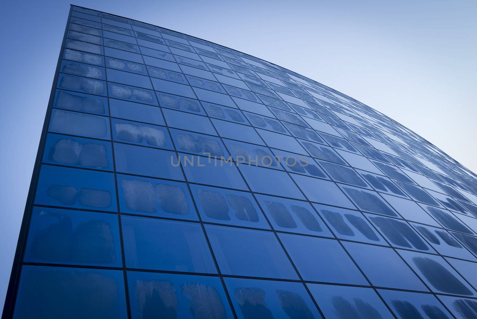 Modern glass building in the morning at wintertime.