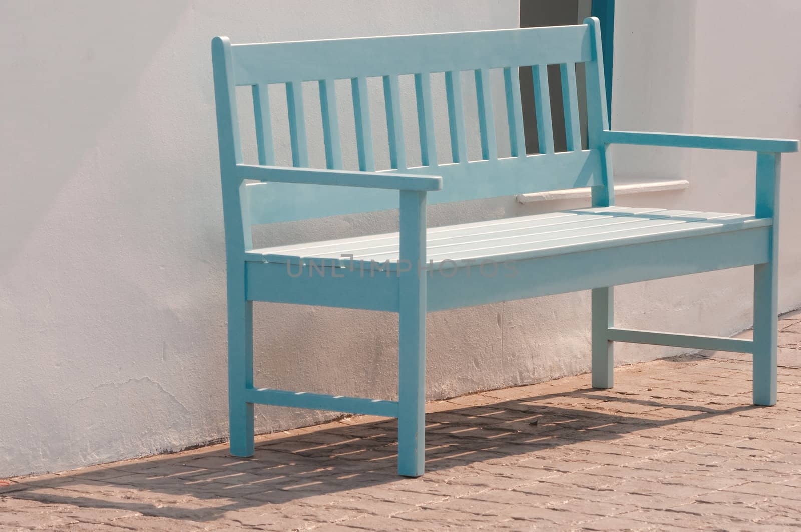 light blue street chair in the park