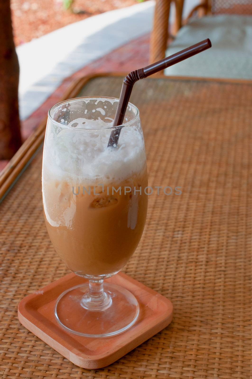 a glass of ice coffee on the table