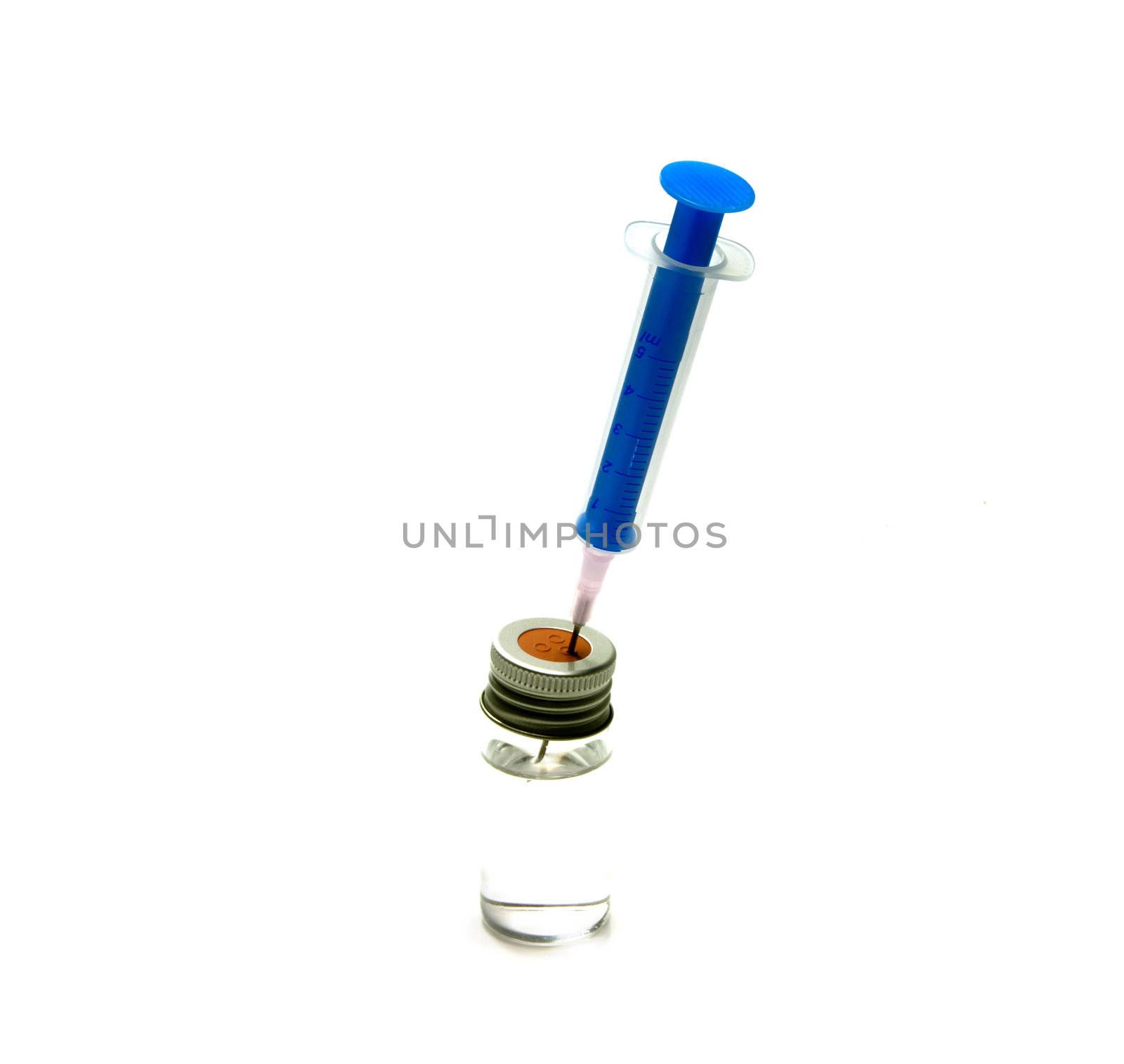 medical needle in bottle with liquid isolated on white