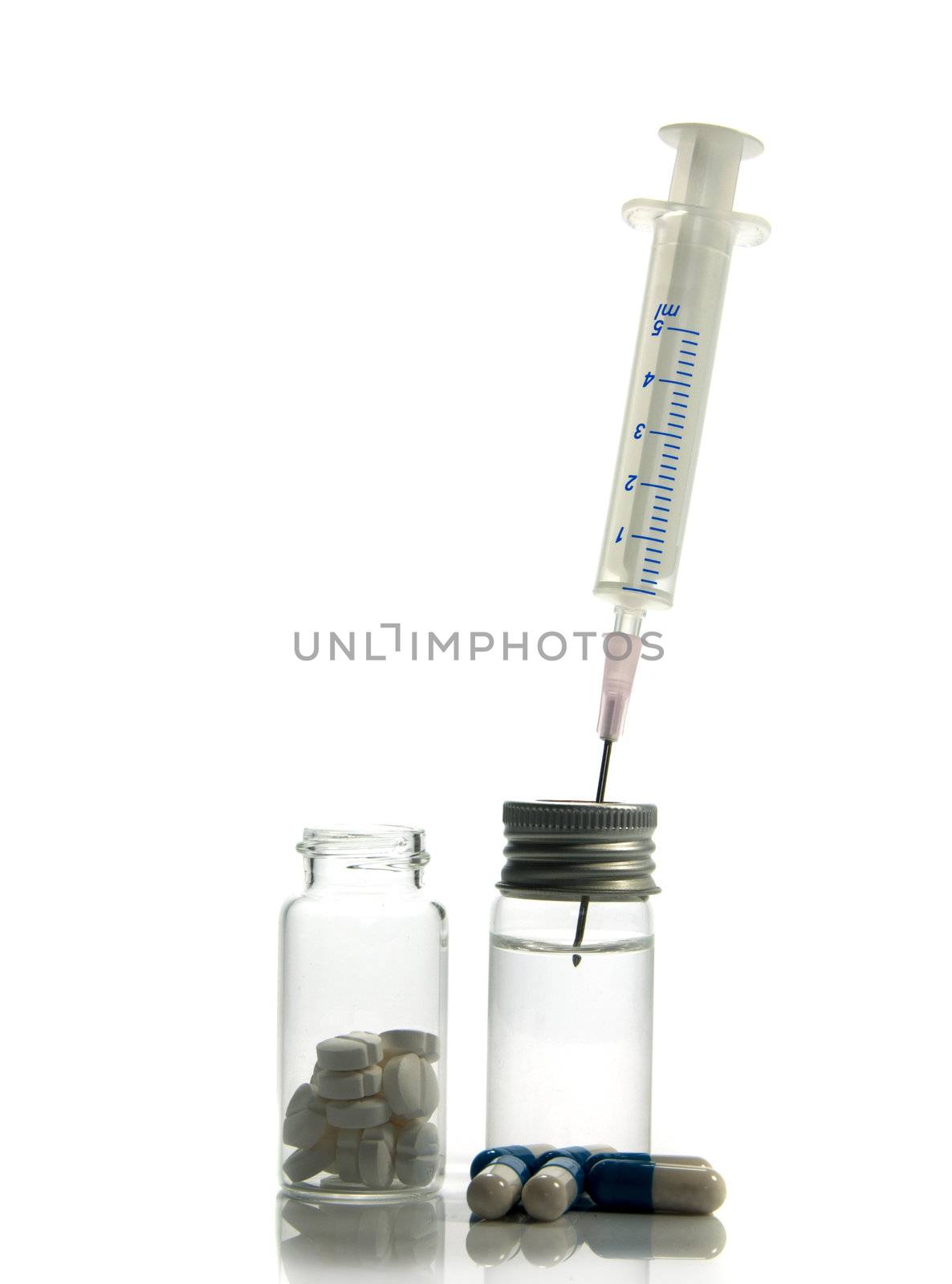 medical needle in bottle with liquid isolated on white