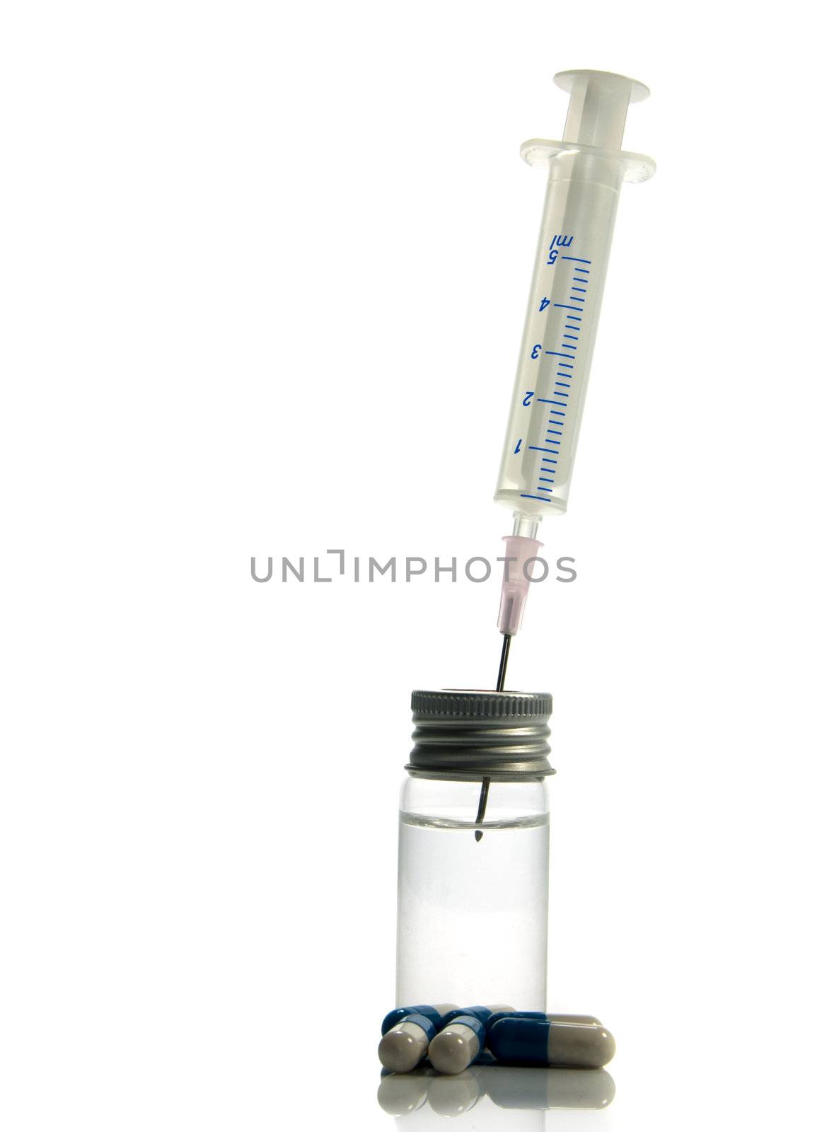 medical needle in bottle with liquid isolated on white