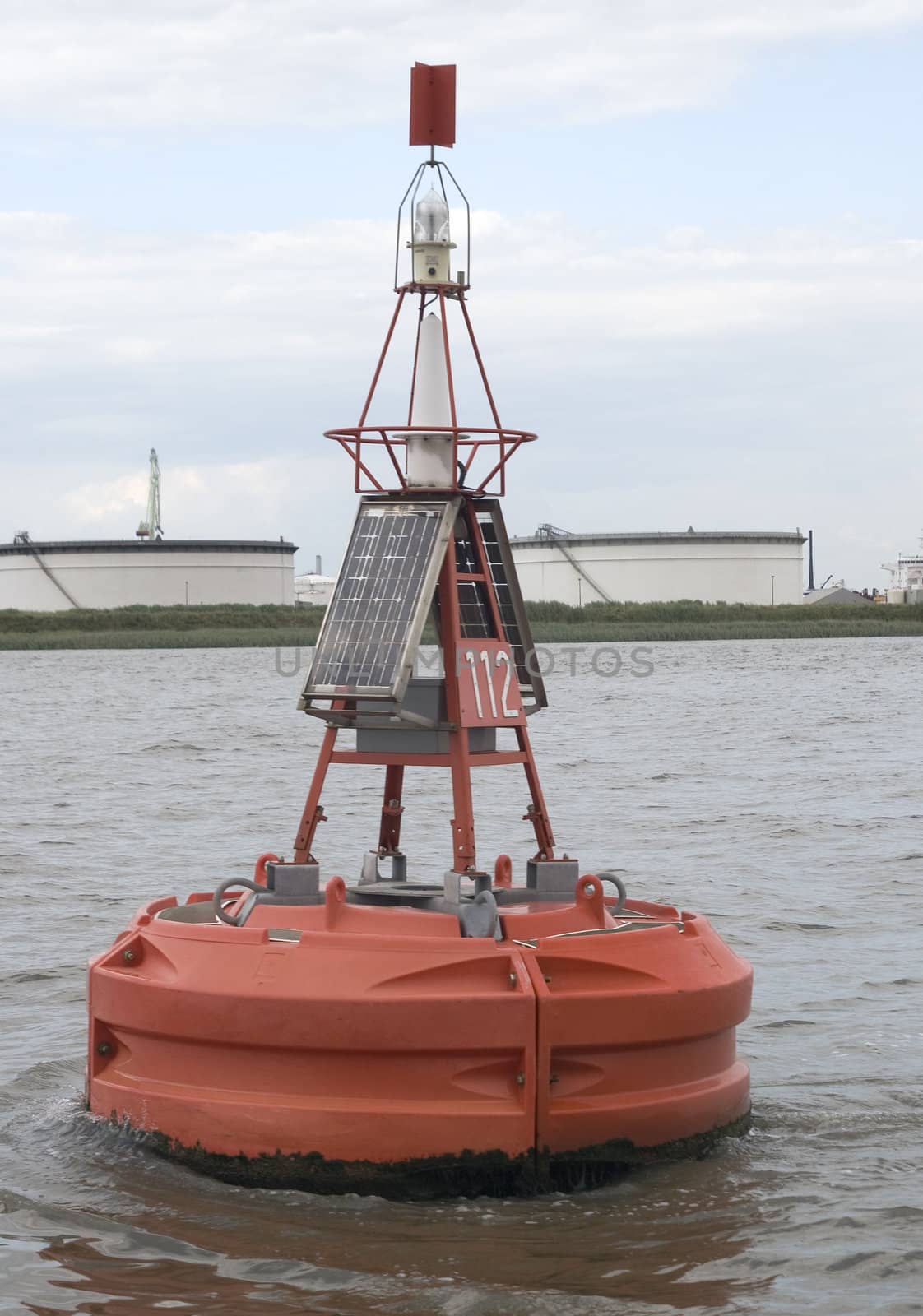 Red buoy marking the navigable depth in Denark