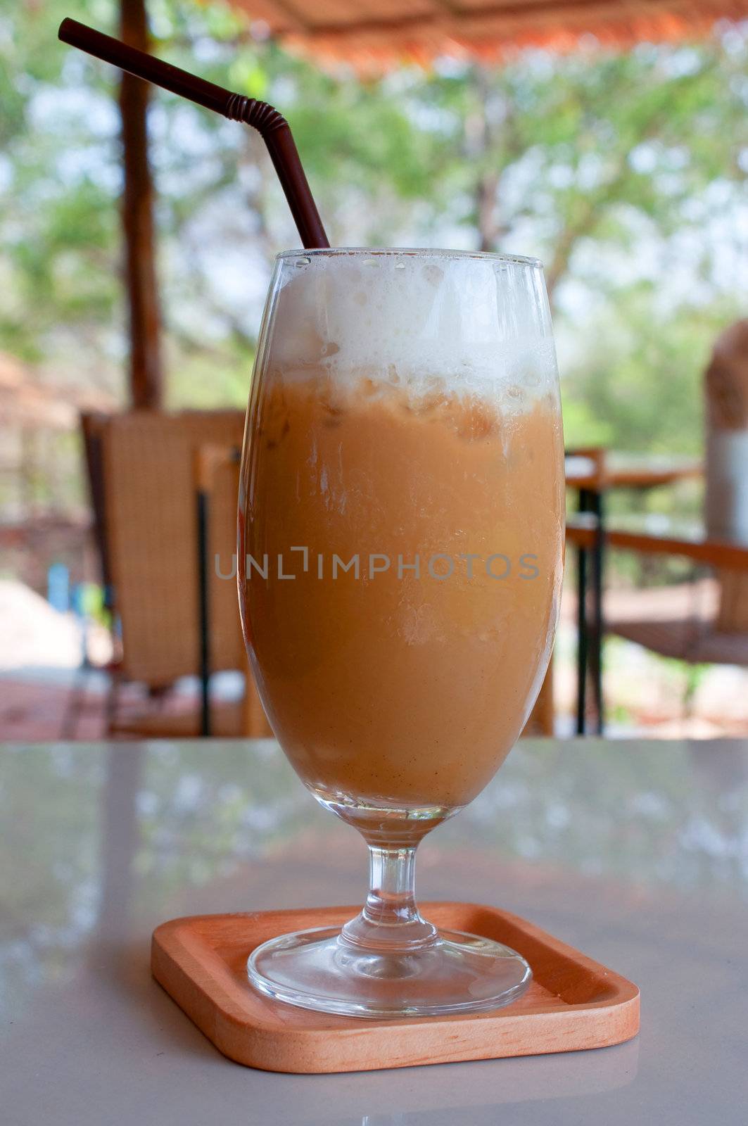 a glass of ice coffee on the table