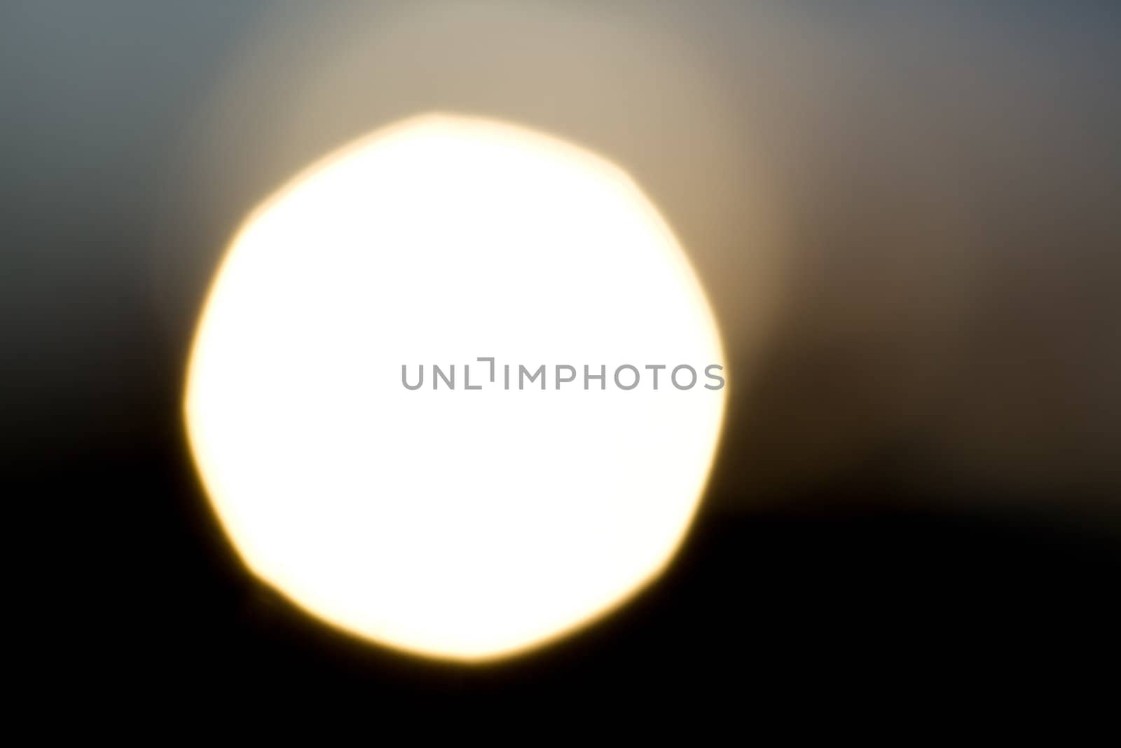 A huge sun against the black sky. Geometric distortion of the circle