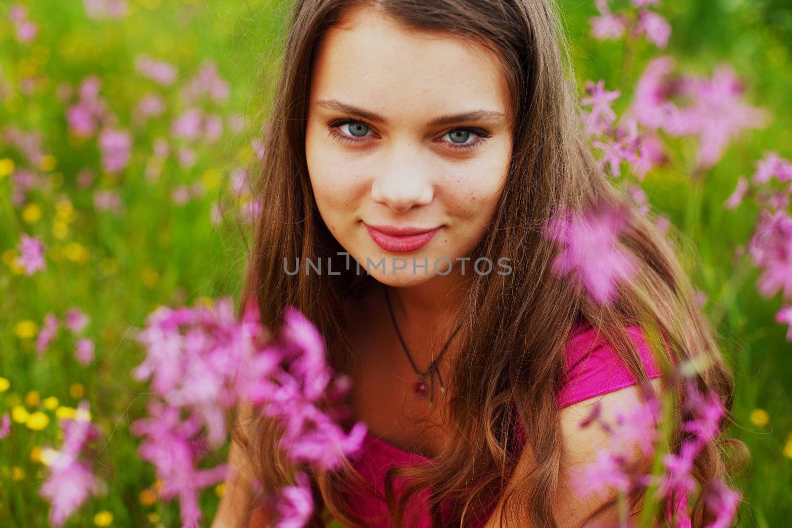 woman on summer flower field